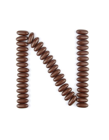 alphabet letter N with chocolate candies (isolated on white background)の写真素材