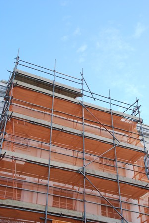 residential building under construction (blue sky background)の写真素材
