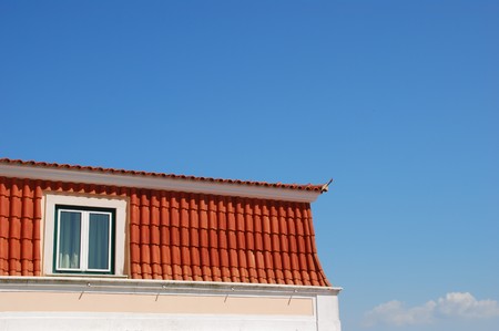 traditional luxury house against blue sky backgroundの写真素材