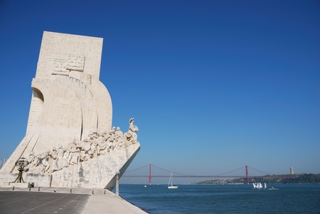 famous monument to the maritime discoveries in Lisbon, Portugal (April 25th bridge on the background)のeditorial素材