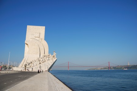 famous monument to the maritime discoveries in Lisbon, Portugal (April 25th bridge on the background)のeditorial素材
