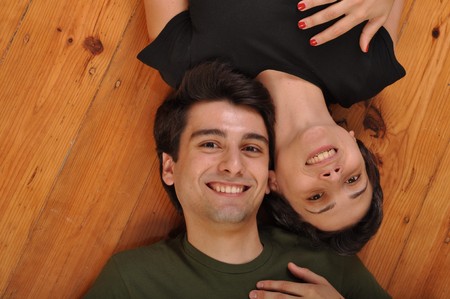 lovely friendship between sister and brother lying and relaxing on the floorの写真素材