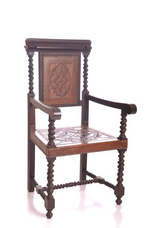 antique black wood airmchair with leather seat isolated on white backgroundの写真素材