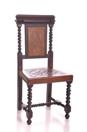 antique black wood chair with leather seat isolated on white backgroundの写真素材