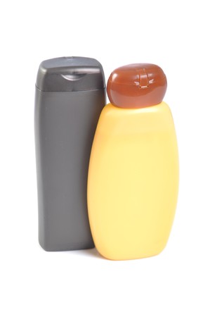 brown and orange sunscreen bottles isolated over the white backgroundの写真素材