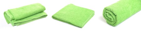 green beach or bath towel collection isolated on white backgroundの写真素材