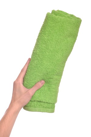 man hand holding green beach towel (isolated on white background)の写真素材