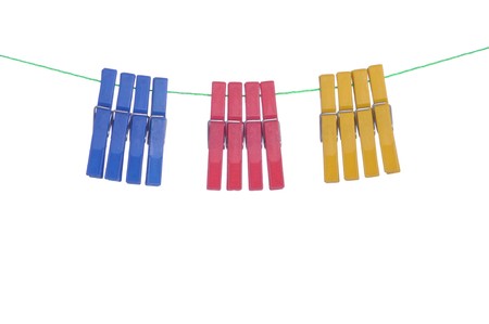 colorful clothespin hanging on a washing line (isolated on white background)の写真素材