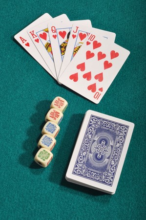 royal flush, poker cards deck and dices on a green cloth backgroundのeditorial素材
