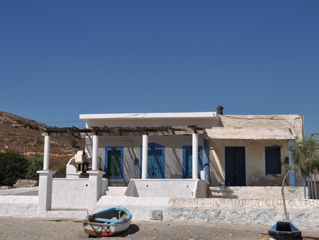 typical blue and white greek house in Pserimos beachの写真素材