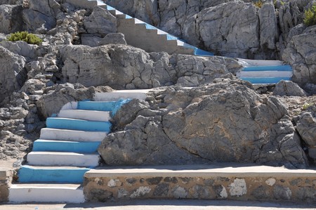traditional white and blue stairs in a Greek islandの写真素材