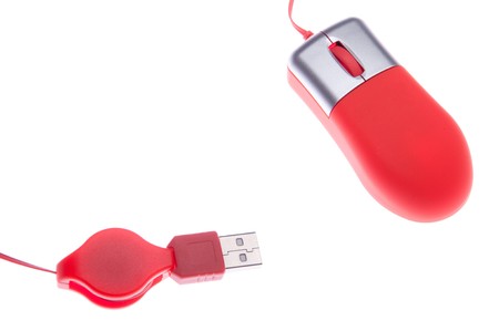 small orange computer mouse with USB port (isolated on white background)の写真素材
