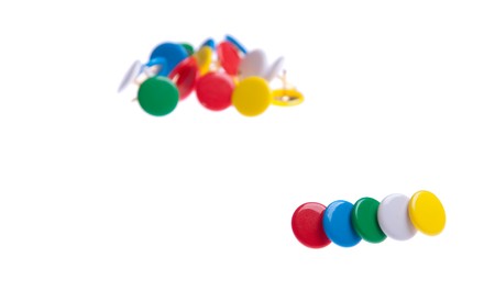 colored push pins isolated on white background (shallow depth of field)の写真素材