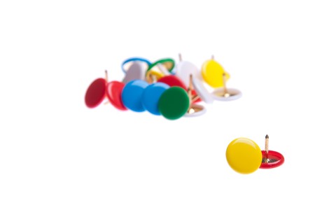 colored push pins isolated on white background (shallow depth of field)の写真素材
