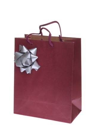 red gift paper bag with grey bow isolated on white backgroundの写真素材