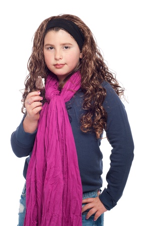 adorable little girl portrait dressed as teenager with long wig and glitter, eating an ice cream (isolated on white background)の写真素材
