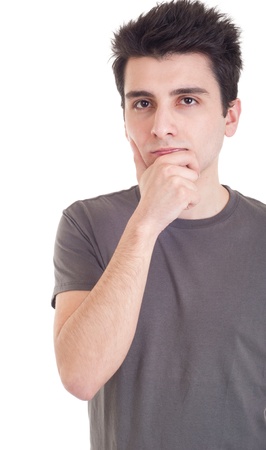 young casual man with a pensive expression isolated on white backgroundの写真素材
