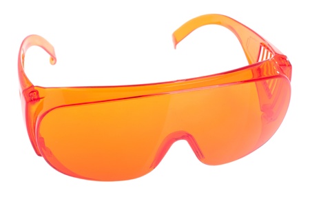 orange safety glasses for patient/other (health equipment to prevent cross infection) isolated on whiteの写真素材