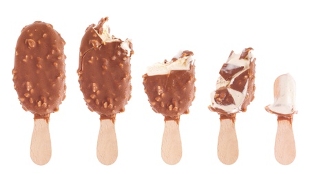 delicious almond chocolate ice cream (being eaten up, sequential images) isolated on white backgroundの写真素材