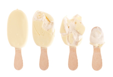 delicious white chocolate ice cream (being eaten up, sequential images) isolated on white backgroundの写真素材