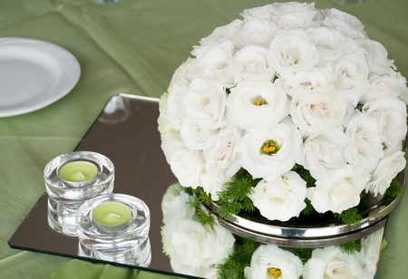 detail of a wedding table with estomas flowers arrangement and candlesの写真素材