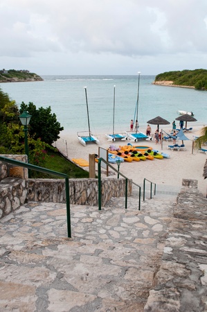 WILLIKIES, ANTIGUA - AUGUST 17: Verandah Resort and Spa beach on Long Bay at sunset on August 17, 2011 in Willikies, Antiguaのeditorial素材
