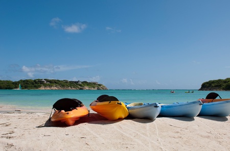 colourful kayaks on a white sandy beach, Long Bay in Antiguaの写真素材