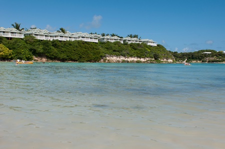 tropical beach and resort villas along the coast in Long Bay, Antiguaのeditorial素材