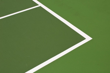 green modern hardcourt tennis as a background or textureの写真素材