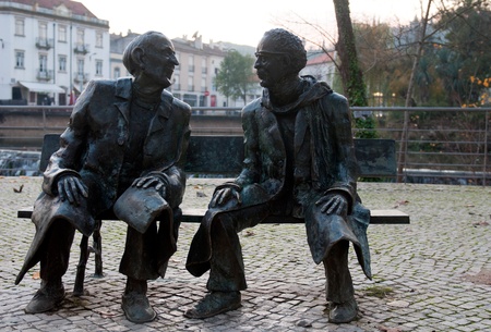 TOMAR, PORTUGAL - DECEMBER 15:  Mouchão Garden bench, bronze statues giving tribute to two sons of Tomar, Fernando Lopes Graça and Fernando Araújo Ferreira on December 15, 2011 in Tomar, Portugalのeditorial素材