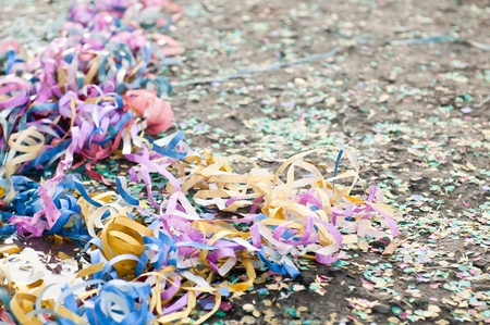 colorful confetti and streamers at the street after Carnival Paradeの写真素材