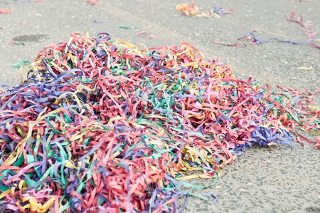 colorful confetti and streamers at the street after Carnival Paradeの写真素材