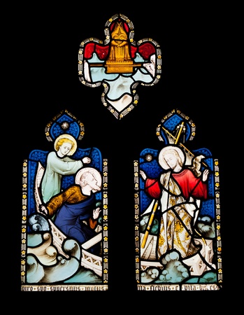 religious stained glass windows in Gloucester Cathedral, England (United Kingdom) (isolated on black background)の写真素材