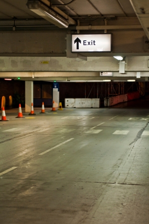 exit sign at an underground parking in the UKの写真素材