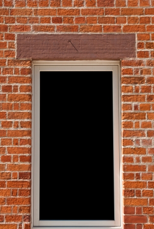 modern window on a brick wall building  isolated on black background, ready for your design の写真素材