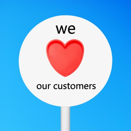conceptual picture regarding business customer care saying we love our customers (against a blue sky background)の写真素材