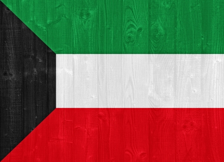 gorgeous Kuwait flag painted on a wood plank textureの写真素材