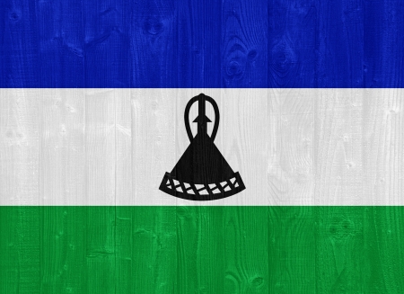 gorgeous Lesotho flag painted on a wood plank textureの写真素材