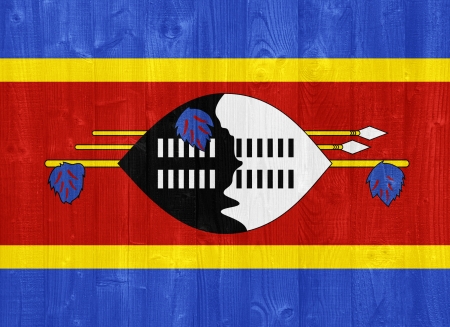 gorgeous Swaziland flag painted on a wood plank textureの写真素材