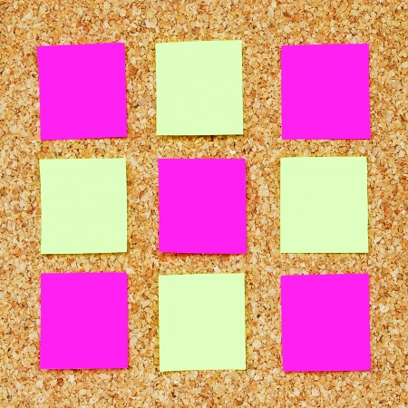 many reminder notes on a corkboardの写真素材