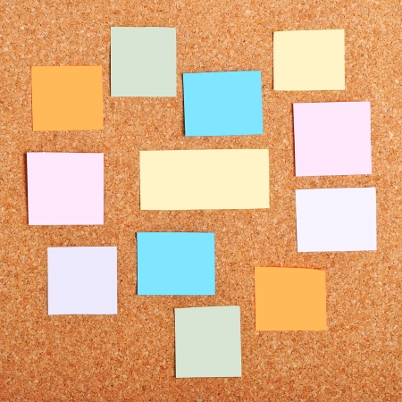 colorful reminder notes on a corkboardの写真素材