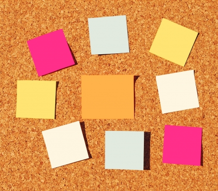 colorful reminder notes on a corkboardの写真素材