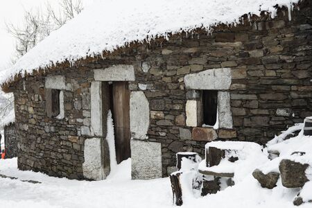 O CEBREIRO, LUGO, SPAIN - OCTOBER 5, 2019: Traditional house (palloza) of Galicia under the snow. In a winter and Christmas landscapeのeditorial素材