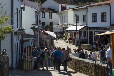 SAN ANDRES DE TEIXIDO, SPAIN - SEPTEMBER 28, 2019: People visiting the picturesque town of San Andres de Teixido.. Street full of typical shops and visitors.のeditorial素材