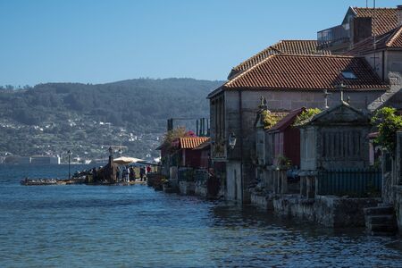 Famous and picturesque village of Combarro, considered one of the most beautiful in Galicia, Spain. At high tide the water from the sea reaches the housesのeditorial素材