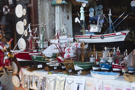 COMBARRO, SPAIN - AUGUST 12, 2019: Exhibition of models of traditional boats in a gift and souvenir shop. In Combarro, one of the most beautiful villages in Galicia, Spain.のeditorial素材