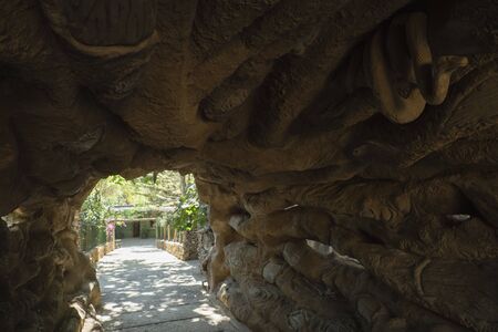 CASTELLAR DE LA FRONTERA, SPAIN - JUNE 21, 2019: Artificial grotto with animal sculptures.. Entrance to the zoo of Castellar de la Fronteraのeditorial素材