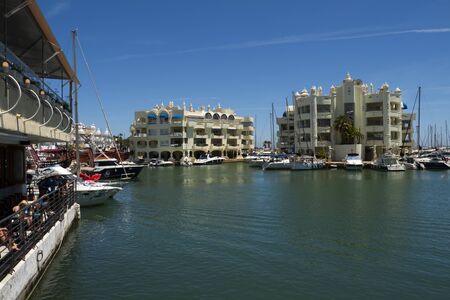 Benalmadena, SPAIN - JUNE 19, 2019: port of Benalmádena, Spain .. View of floating buildings in the background and boatsのeditorial素材