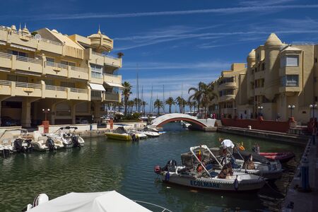 Benalmadena, SPAIN - JUNE 19, 2019: Marina of Benalmádena, Spain .. View of the boats in the foreground and the floating buildings in the background.のeditorial素材