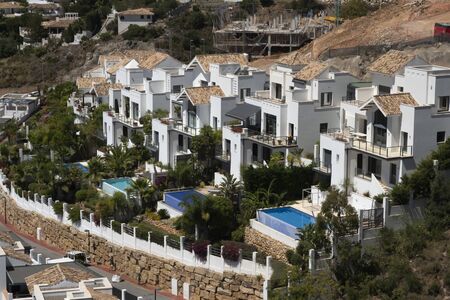 Benalmadena, SPAIN - JUNE 19, 2019: White townhouses with pool. On the Mediterranean coast of Malaga, Spainのeditorial素材